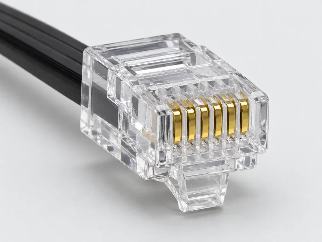 6P6C modular plug (often sold as RJ12): three-quarter view. Computer-generated illustration, not a photograph.